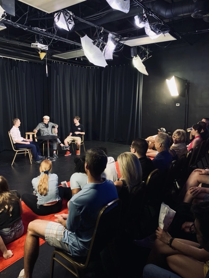 The studio theater at Dearing Acting Studio: an audience seated close to three performers under stage lights